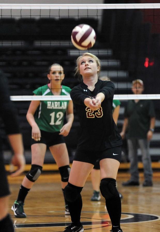 
Harlan County senior Brittany Clem set the ball in district volleyball action Tuesday. Clem set up several of her teammates for kills throughout Harlan County’s four-set win over Harlan.