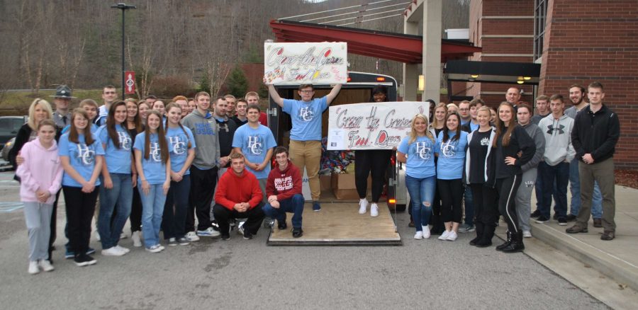 Members of the Harlan County High School Link Crew members are pictured after collecting over 1,100 cans as part of the Cram the Cruiser Food Drive.