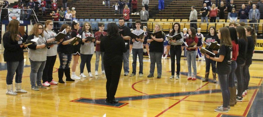 The Harlan County High School choir, under the direction of Jeanne Ann Lee, performed the National Anthem during the WYMT Mountain Classic on Wednesday at Knott Central High School.