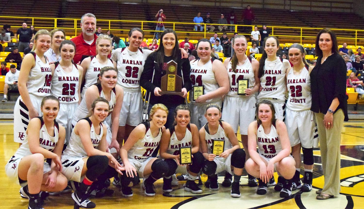 The Harlan County Lady Bears are pictured with their championship trophy after defeating Harlan in the 52nd District Tournament finals.