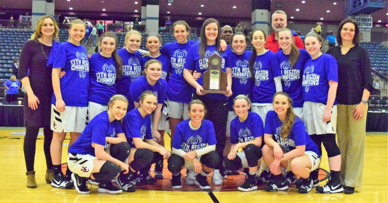 The Harlan County Lady Bears after pictured with their championship trophy after capturing the 13th Region Tournament title for the first time with a 78-51 win over North Laurel. 