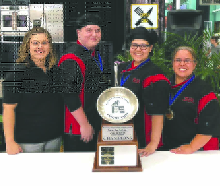 The Harlan County High School Junior Chef Team of Kieran Chadwick and Selena Moreno and coaches Chasity McCarty and Leilani Kelly are shown with top award received Friday after being named the top team in the 2018 Farm to Chef competition sponsored by the Kentucky Department of Agriculture.
