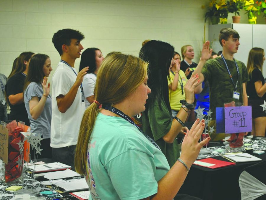 Harlan County High School Link Crew members took an oath during a training session last week. The Link Crew was formed at HCHS to help freshmen make the transition to high school with the aid of some of the school’s seniors.