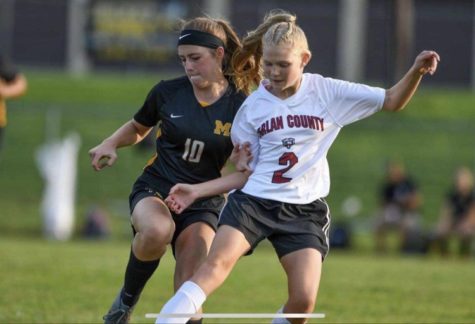 Harlan Countys Leah Taulbee battled for the ball in recent soccer action.