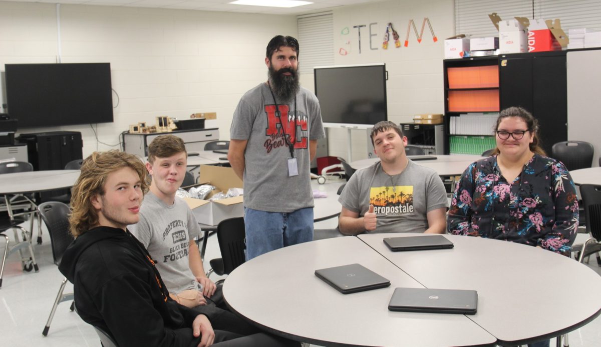 Members of the Harlan County robotics team that qualified for state competition, include, from left: Joshua Stewart, Dylan Clem, Donovan Saylor and Sarah Boggs. The team is coached by HCHS teacher Garrett Bolin.